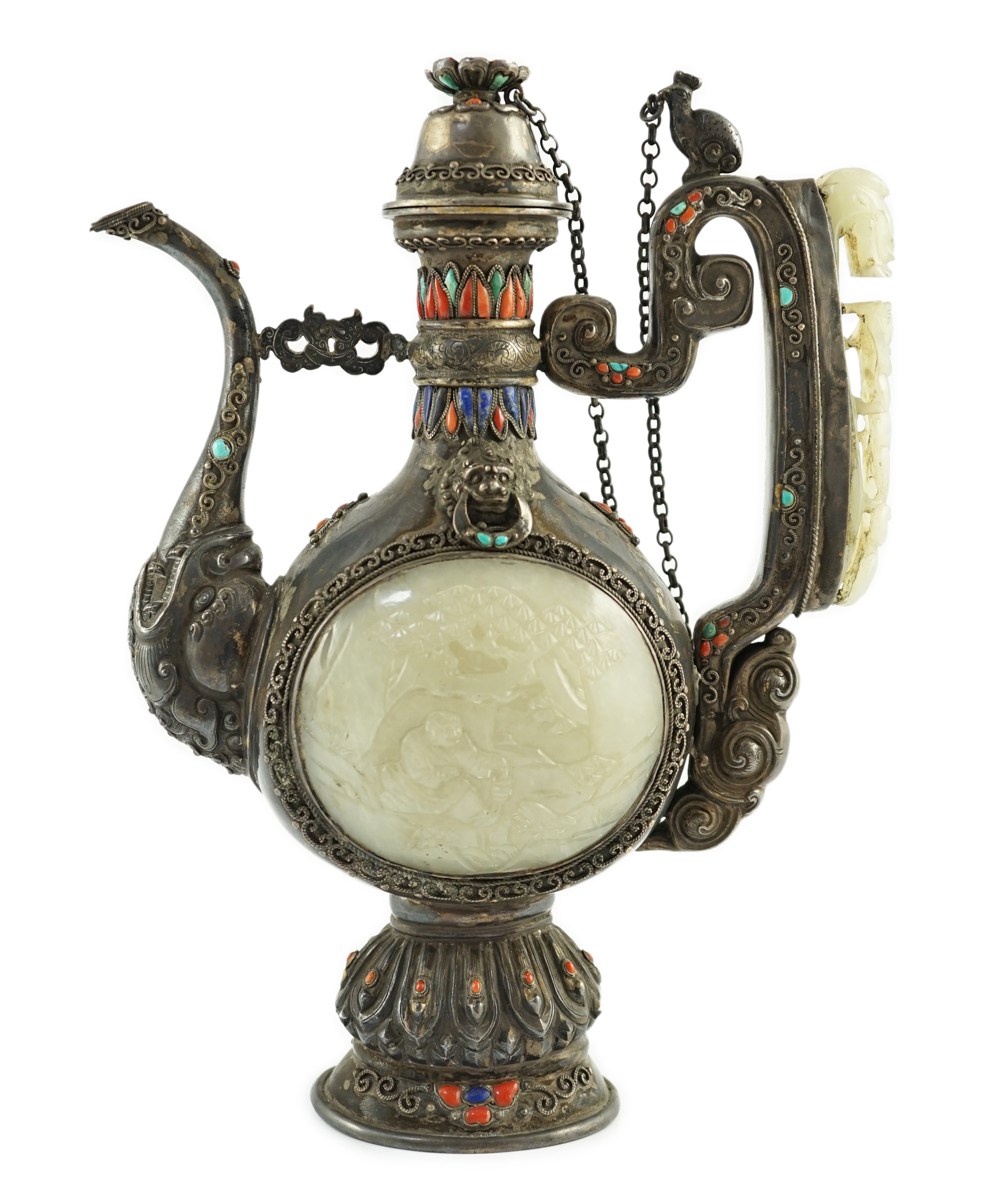 A Tibetan silver, jade, coral and hardstone mounted ewer, late 19th century, the Chinese pale celadon jades, 18th/19th century finial lacking stones